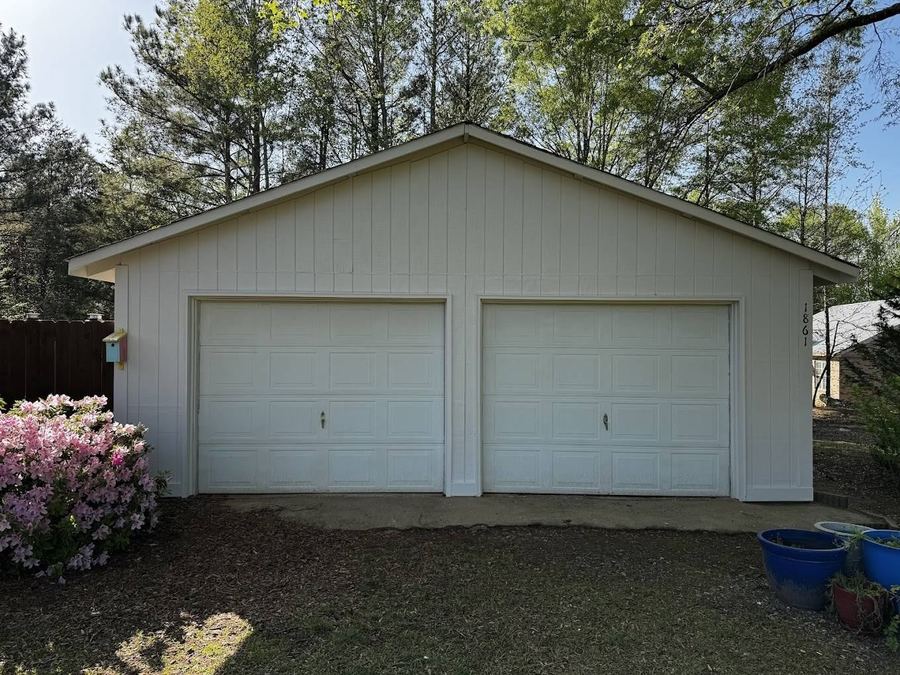 Detached two-car garage with a fresh exterior paint finish